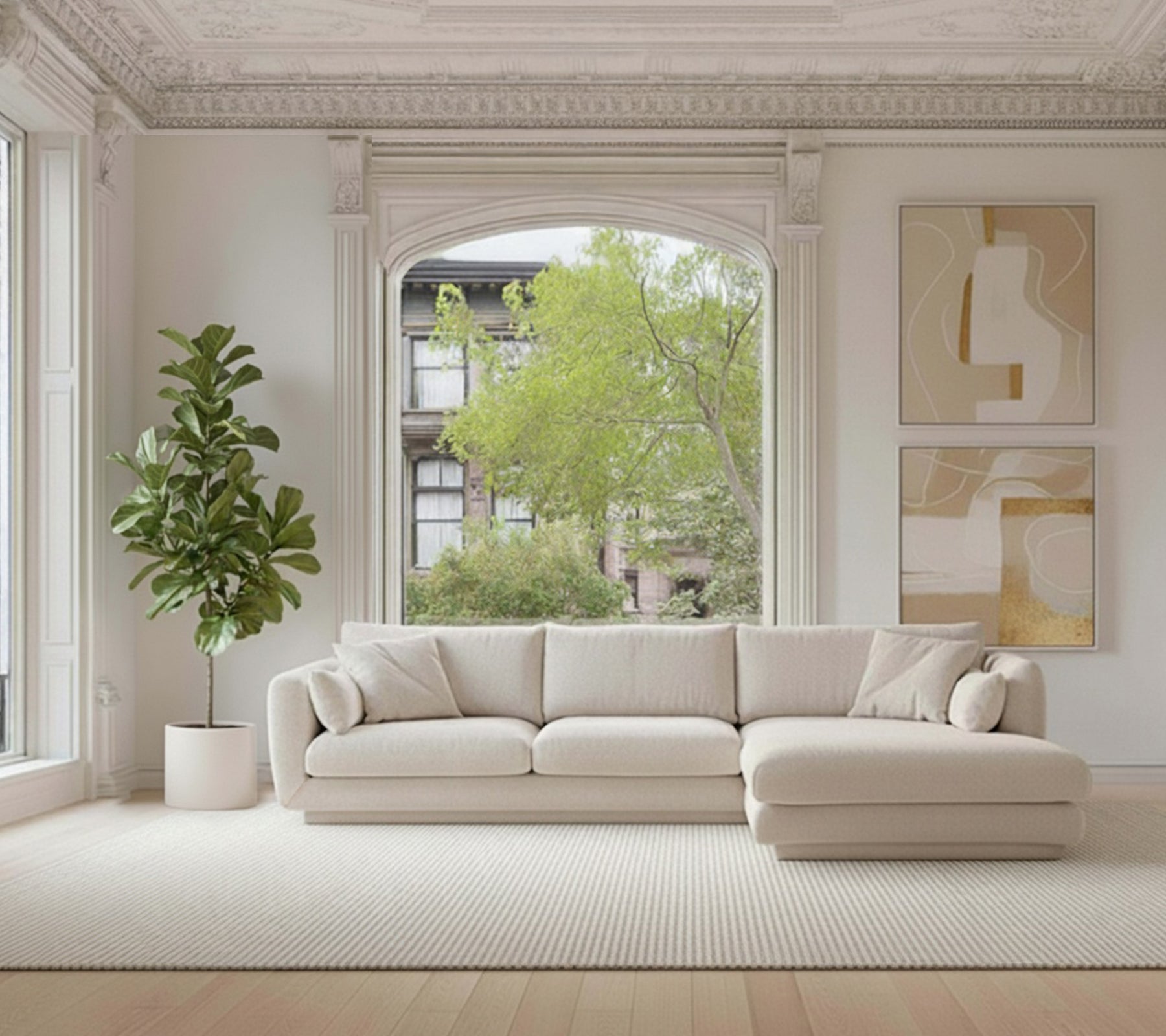 Beige sectional sofa with a green plant and white rug in a modern lounge setting.