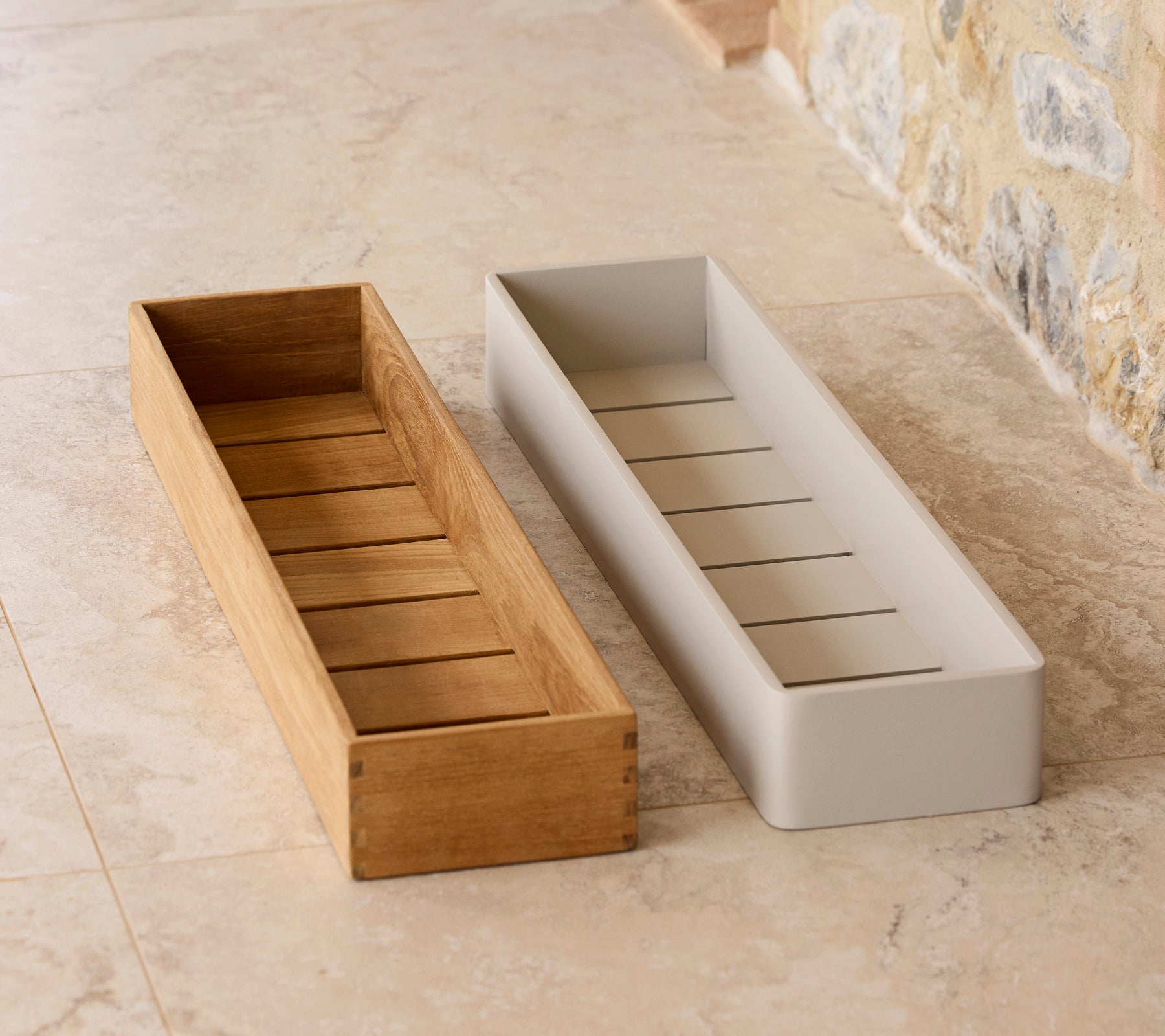 Two club storage boxes in contrasting designs: one wooden with slats, the other smooth and white, ideal for organizing items.